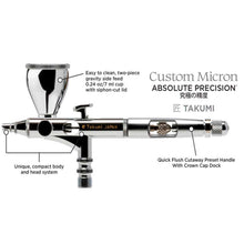 TAKUMI Custom Micron Side-Feed airbrush with compact body, two-piece gravity side feed cup, and quick flush preset handle.