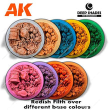 AK Deep Shades Reddish Filth showing textured miniature terrain effects in varied base colors for detailed model highlights.