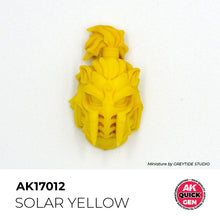 AK Interactive Quick Gen Solar Yellow miniature head painted in vibrant warm matte yellow for fantasy and divine themes.