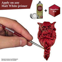 The Army Painter Speedpaint Slaughter Red being applied on a miniature over matt white primer for rich shading and highlights.