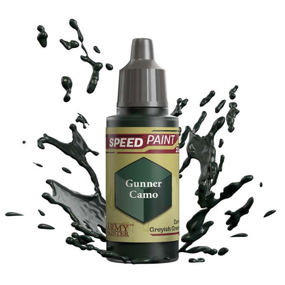 The Army Painter Speedpaint Gunner Camo bottle with dark greyish green paint splashing dynamically around it.