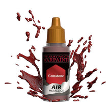 The Army Painter Air Gemstone metallic paint bottle with red paint splashes surrounding it on white background