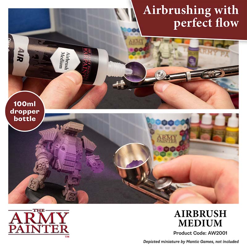 The Army Painter Airbrush Medium being poured into an airbrush for smooth painting flow and miniature detailing.