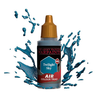 The Army Painter Air Twilight Sky paint bottle with blue paint splashes demonstrating vibrant pigment and smooth flow.