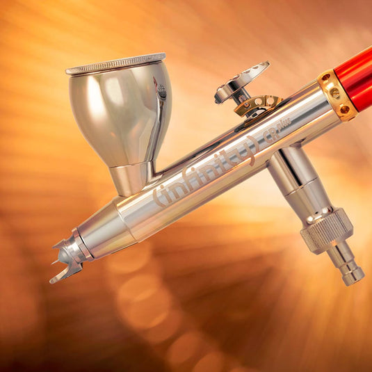 Harder & Steenbeck Infinity 2024 CR Plus 2n1 airbrush with titanium nozzle and dual cup system for precise detail and control.
