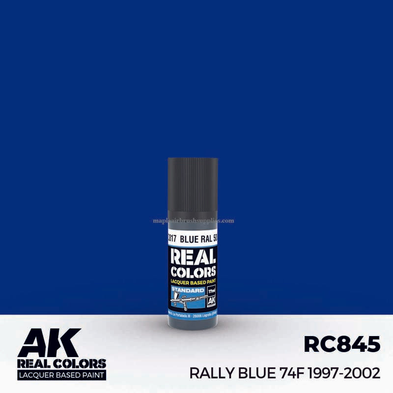 AK Interactive Real Colors Rally Blue 74F 1997-2002 lacquer paint bottle on blue background for scale modeling.