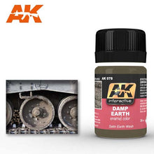AK Damp Earth Effects enamel color bottle with mud and damp earth texture effects on vehicle wheels and tracks.
