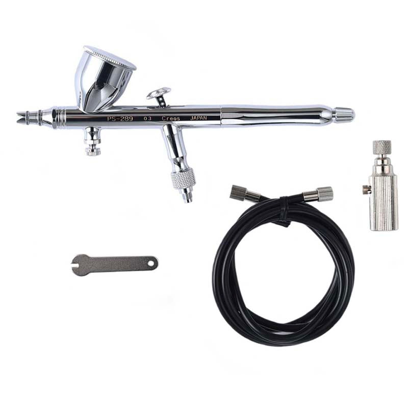 Mr Hobby Airbrush PS289 with 0.3mm nozzle, wrench, hose, and air valve for precision paint application.
