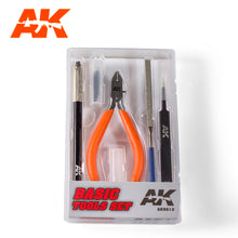 AK Basic Tool Set with precision pliers, file, screwdriver, and other tools in a transparent case for modeling projects.
